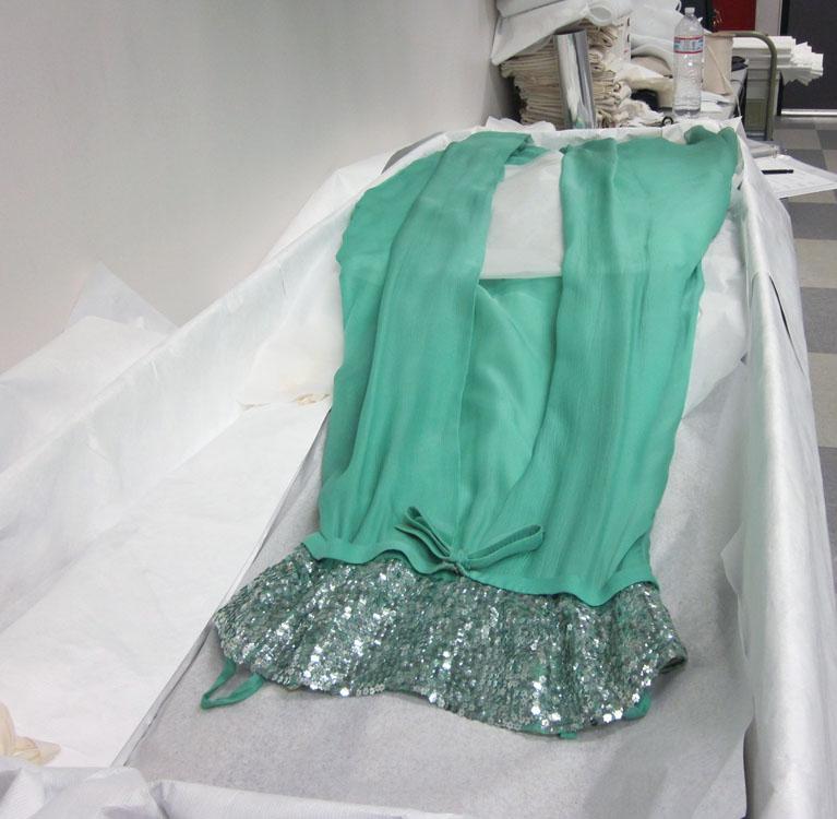 Green dress laid out